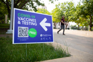 A sign for free COVID-19 vaccines and testing at the Health center at Auraria.