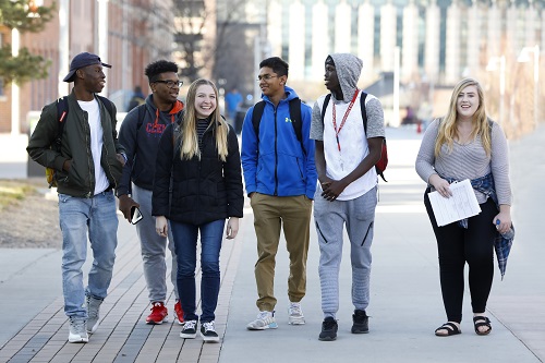 Group of students walking on campus.