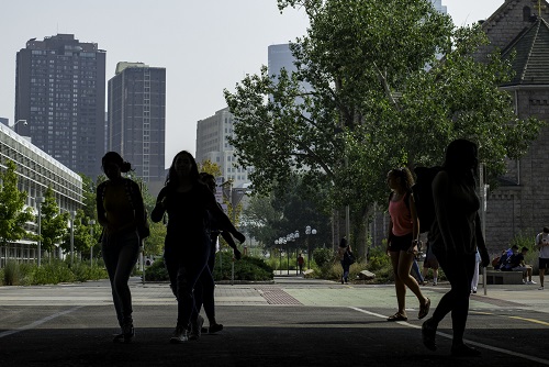 Silhouettes of students walking on Auraria campus.