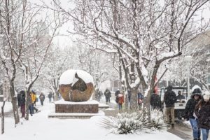 Students walking across Auraria Campus in winter.