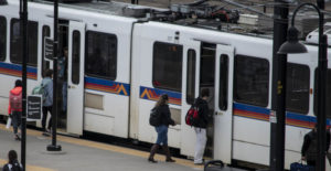 People entering an RTD light rail on Auraria campus.