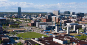 Aerial view of campus and Denver skyline.