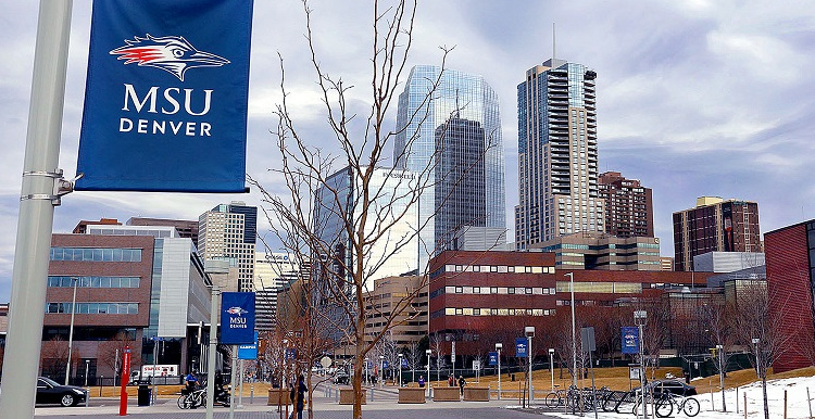 MSU Denver skyline from Auraria campus with an MSU Denver flag hanging from a light post.