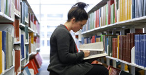 Student reading in the library.