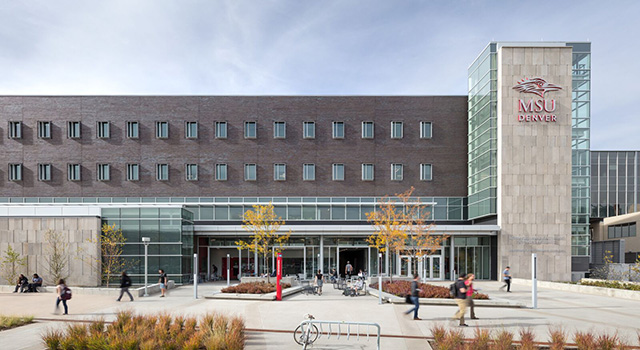 Aerospace and Engineering Sciences Building exterior on a sunny day with students walking