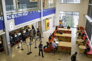 Students line up and sit outside of the office of financial aid and scholarships at MSU Denver in the Jordan Student Success Building