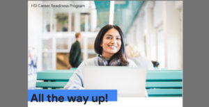 Woman sitting on a bench in the JSSB working on her laptop. 