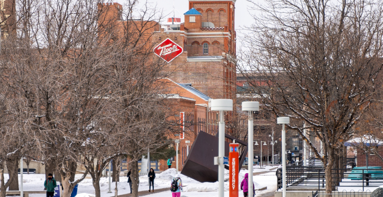A snow covered campus and the Tivoli building.