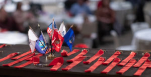 Military flags and medals displayed on a table.