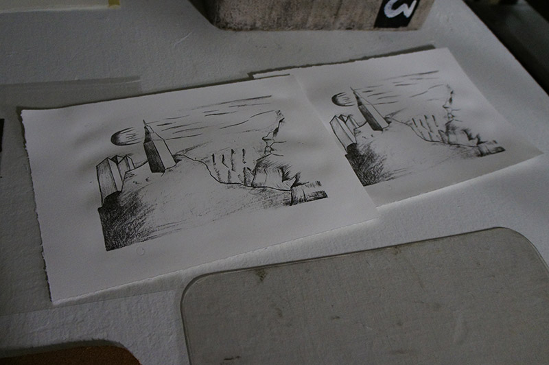 Two identical abstract landscape sketches featuring mountainous forms and geometric shapes.