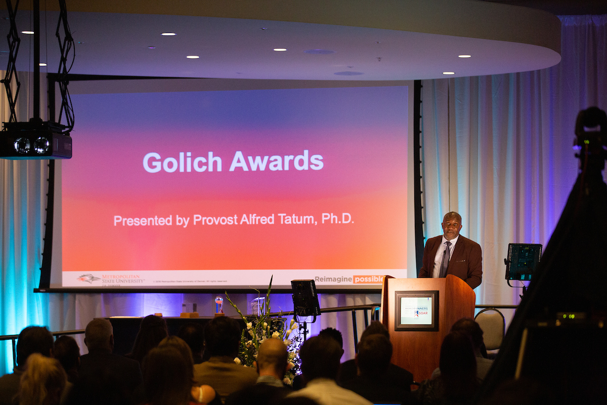 Provost Alfred Tatum, Ph.D., announces the Golich Awards category at 2021 Roadrunners Who Soar Awards ceremony.