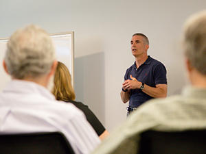 Professor Andrew Traver teaching in a classroom.