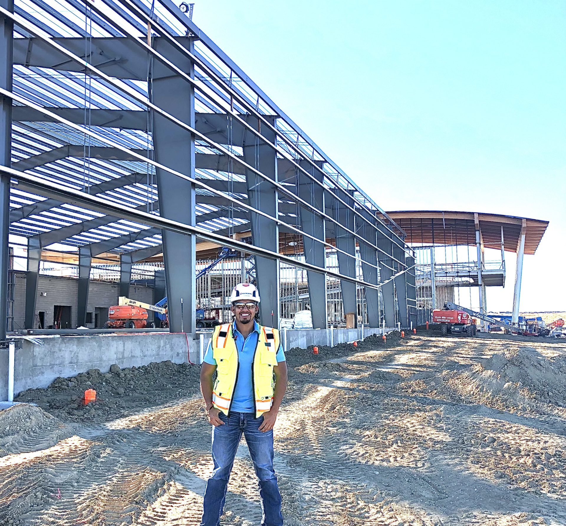Photo of Johnatan in front of construction building