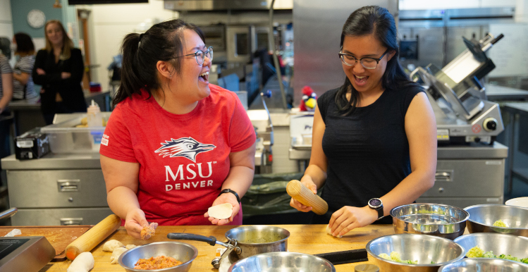Sophia Tran, (left,) and Stephanie Lee making Nepalese momo dumplings.