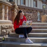 Online MSU Denver student studying outside