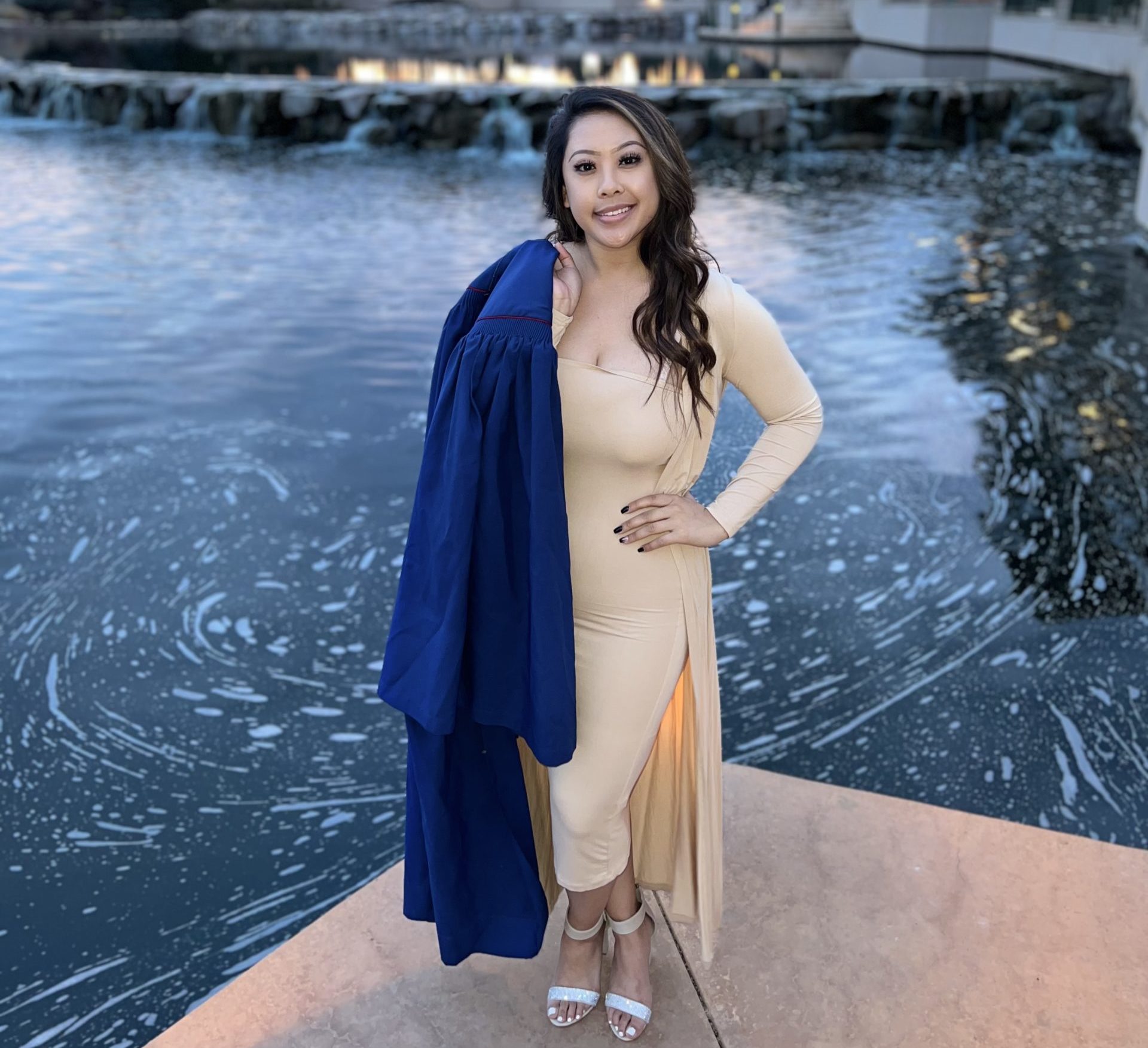 Photo of Joleena with graduation gown