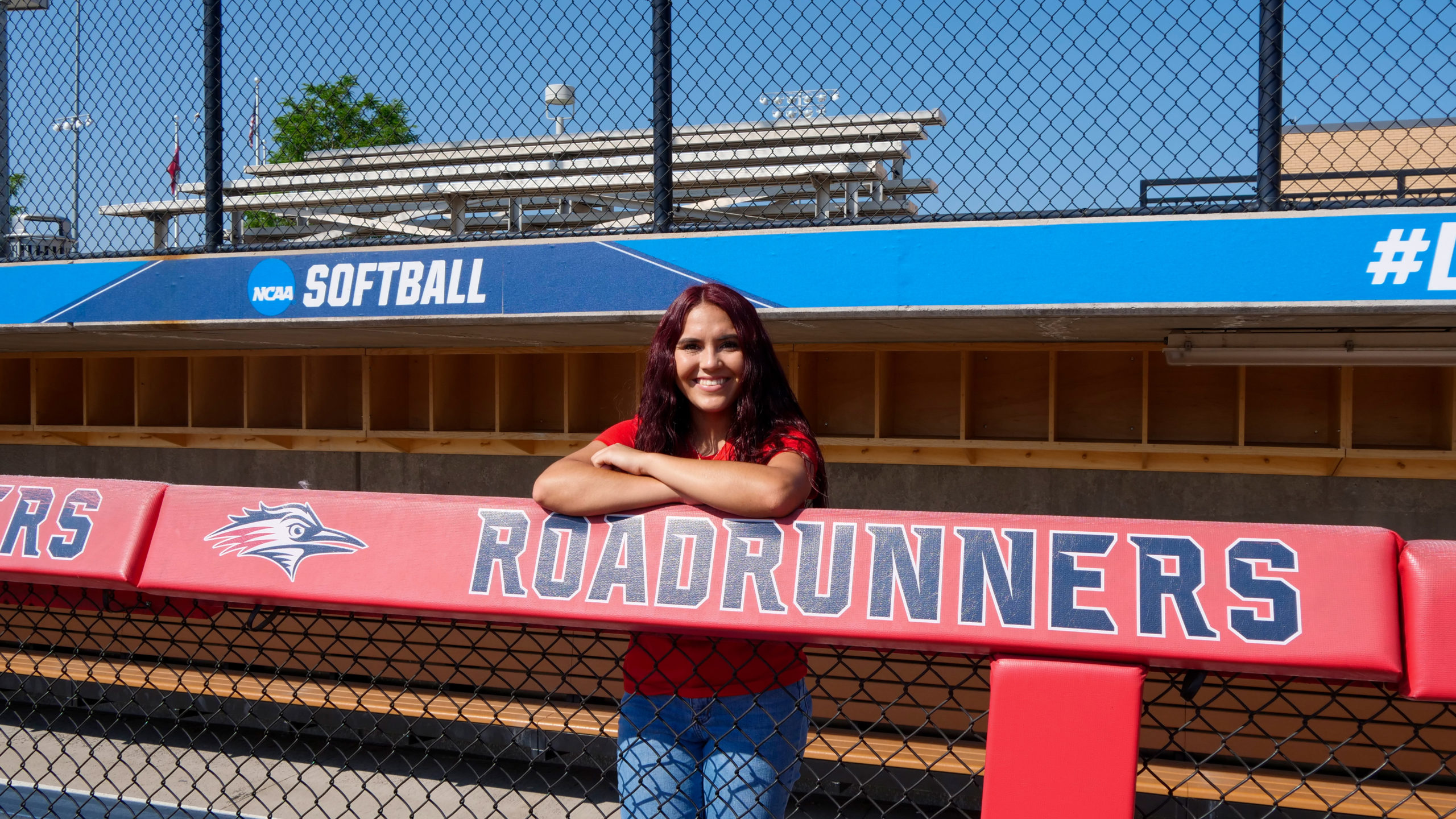 Arianna Valdez standing in the softball dugout at MSU Denver.