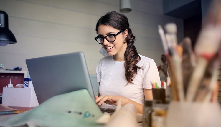 A woman working at a computer Photo by Andrea Piacquadio from Pexels.