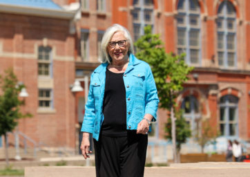 Barb Grogan standing with the Tivoli in the background