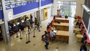 Students lined up at Financial Aid counter in lobby of JSSB.