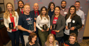 MSU Denver Marketing and Communications team holding awards.