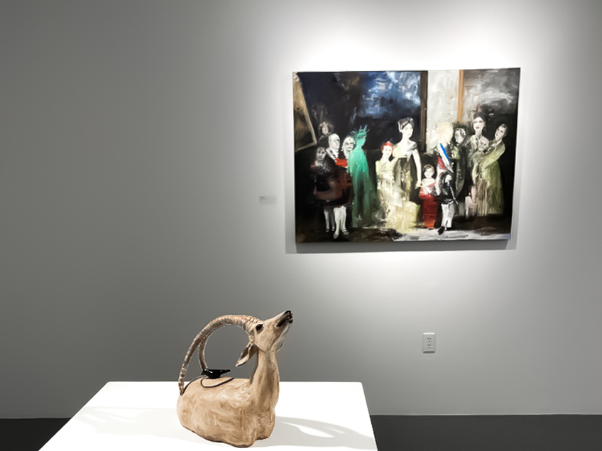 A gallery displays a historical-themed painting and a ceramic animal sculpture.