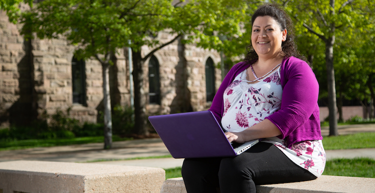 Student on computer is Ruth Delgado.