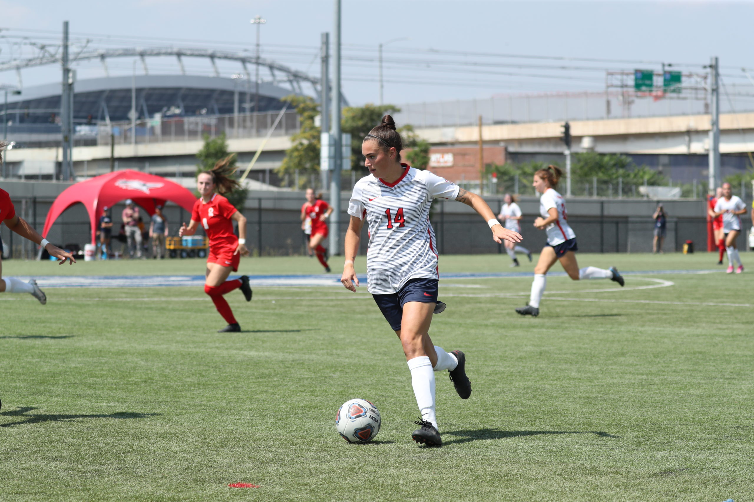 Soccer player Annie Rolf dribbles during a 2021 game vs. Simon Fraser.