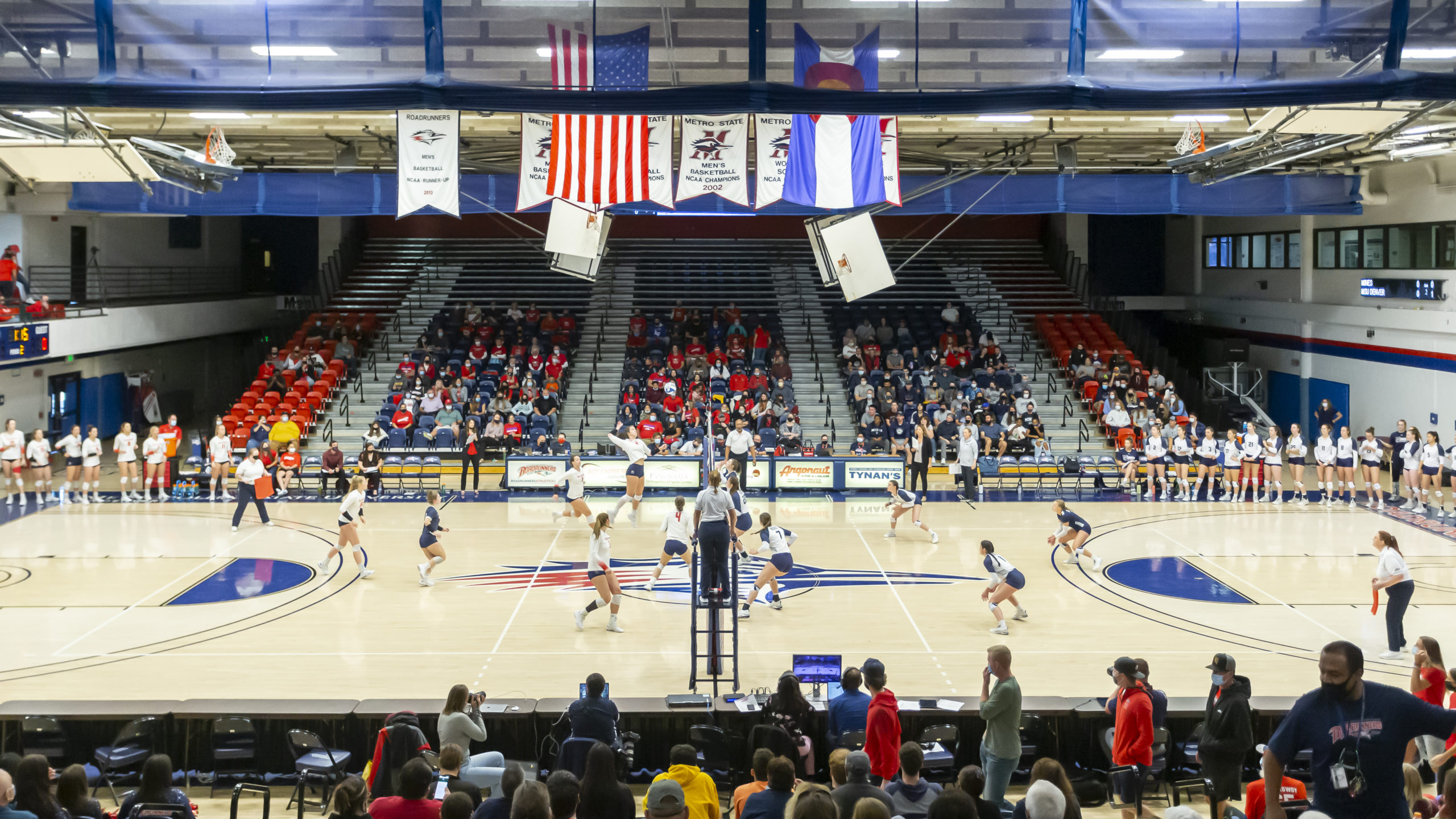 Auraria Events Center with a large crowd during a volleyball match in 2021.