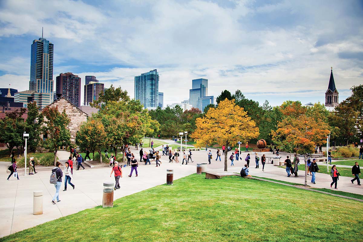 Students walking through a sunny Auraria Campus.