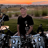 Ernie Navarette sitting behind a drum kit