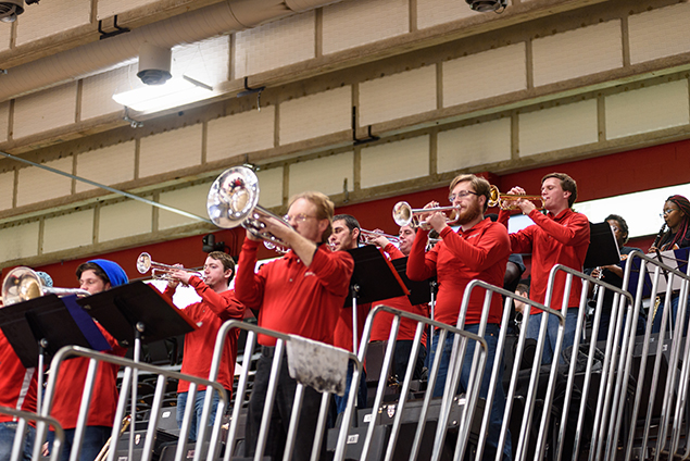 Pep Band members playing brass instruments on risers