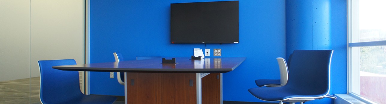 Blue study room with desk and chairs