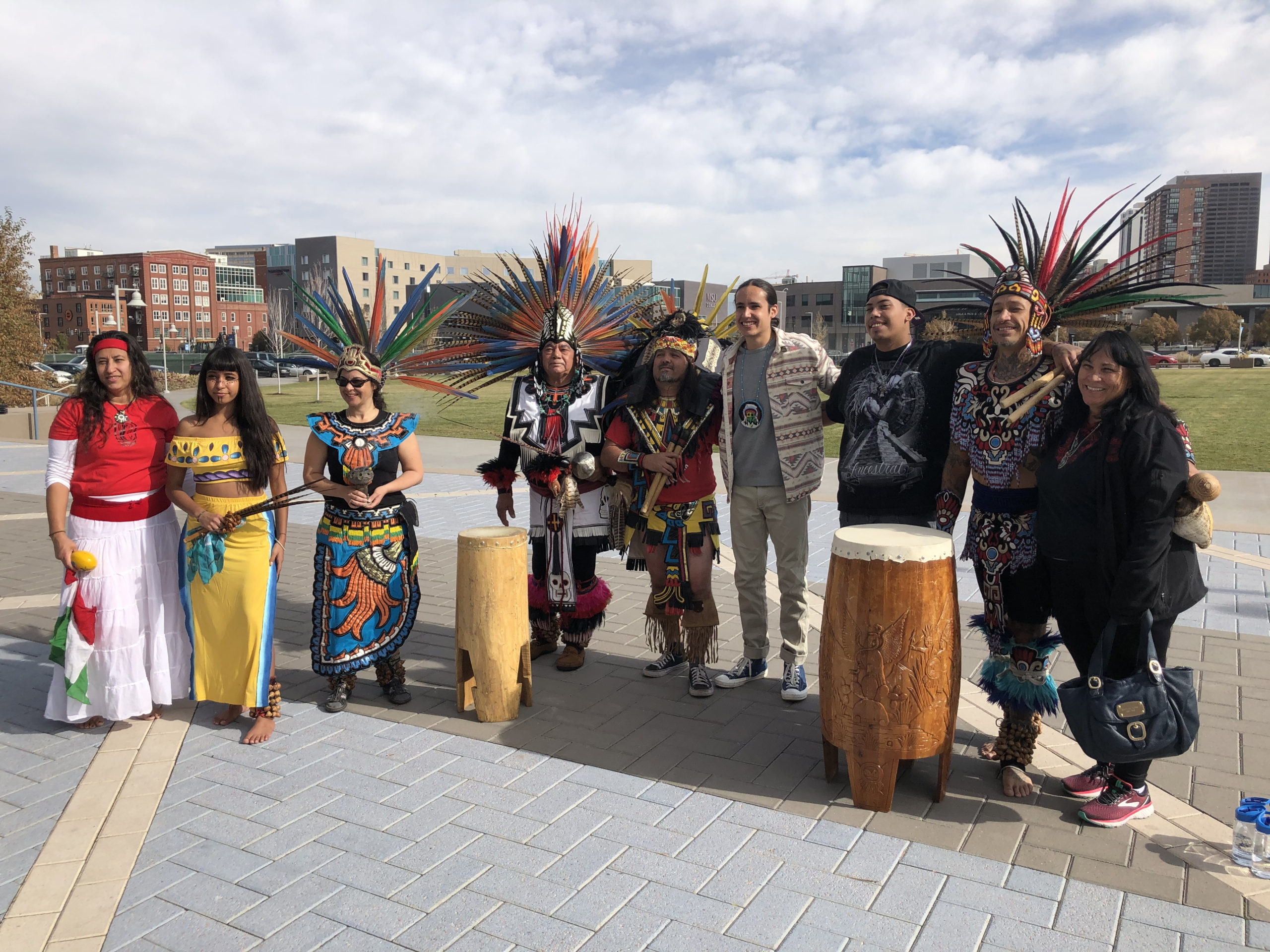 Author Xiuhtezcatl Martinez and a group of Indigenous Dancers posing for a photo