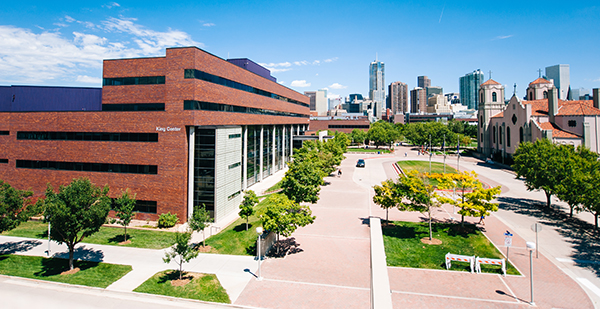 The King Center building with Denver skyline in background