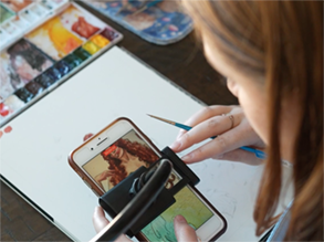 Alumna Molly Quinn uses TikTok videos to help propel her watercolor business to success.