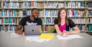 Two students in the library.