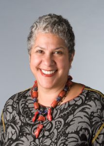 Dr. Shakti Butler wearing a red necklace