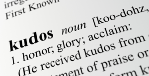 Kudos: noun. Honor, glory, acclaim. He received kudos.