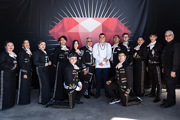Members of the Mariachi Estelares de Colorado standing together with their instruments