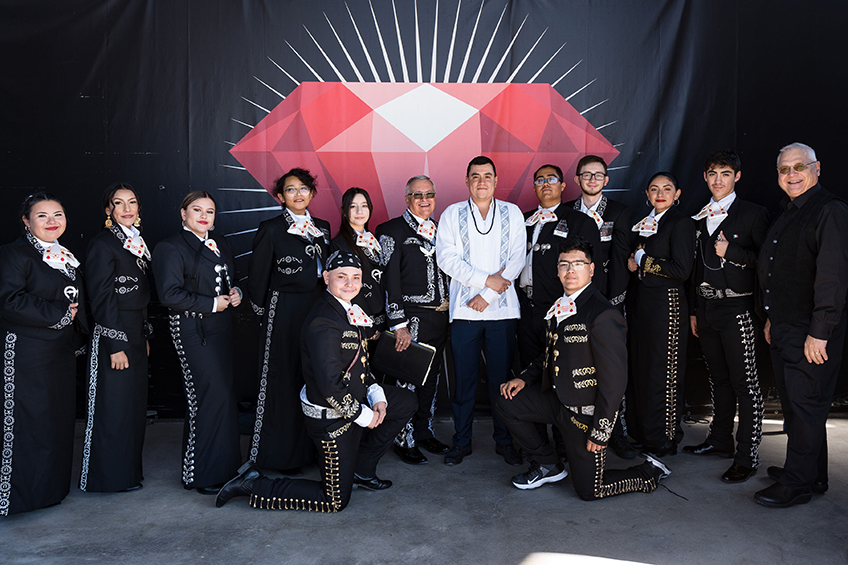 Mariachi Estelares de Colorado posing in front of jewel banner