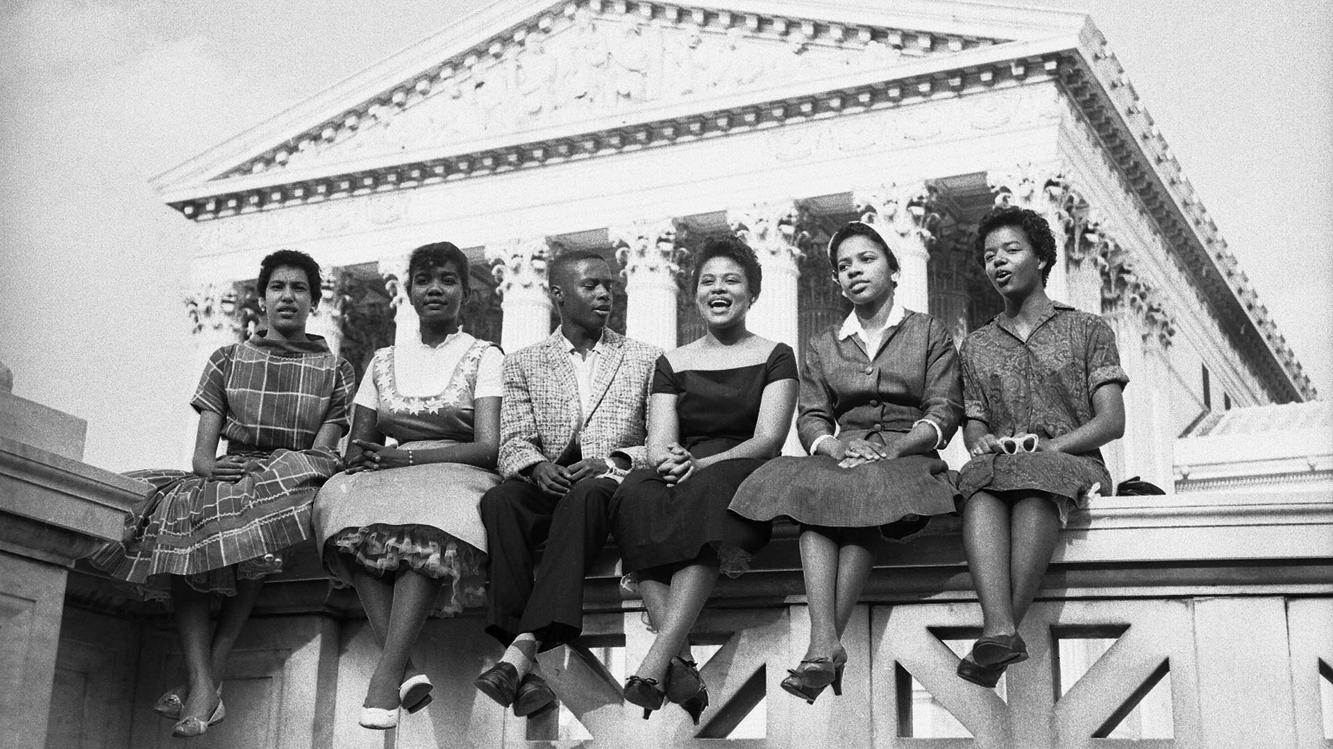 Six Black children who attended Little Rock's Central High School sit outside the Supreme Court in this 1958 photo. From left to right: Carlotta Walls, 15, Melva Patillo, 16, Jefferson Thomas, 15, Minnie Jean Brown, 16, Gloria Ray, 15, and Elizabeth Edkford, 16. Photo: Getty Images