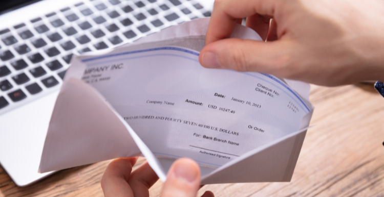 Stock image of person opening a fake paycheck