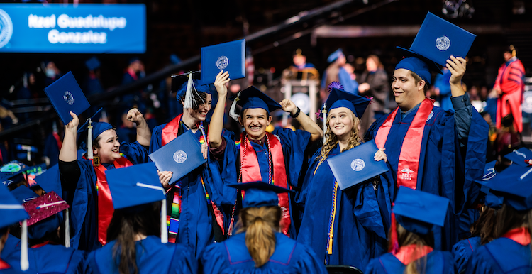 Students celebrate at their commencement ceremony.