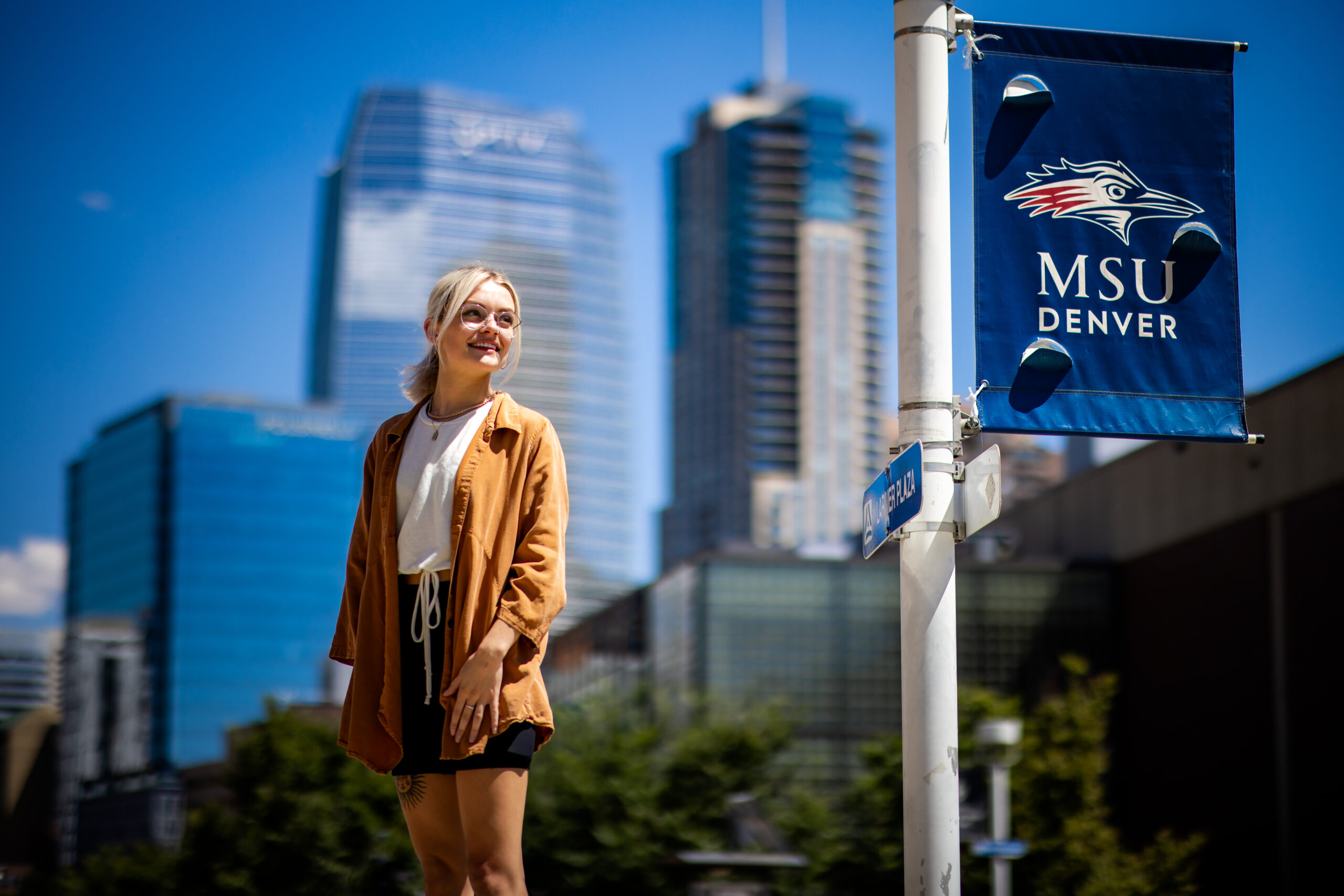 Student stands on campus.