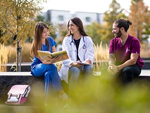 Health care students studying outside