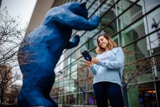 MSU Denver online student studying outdoors