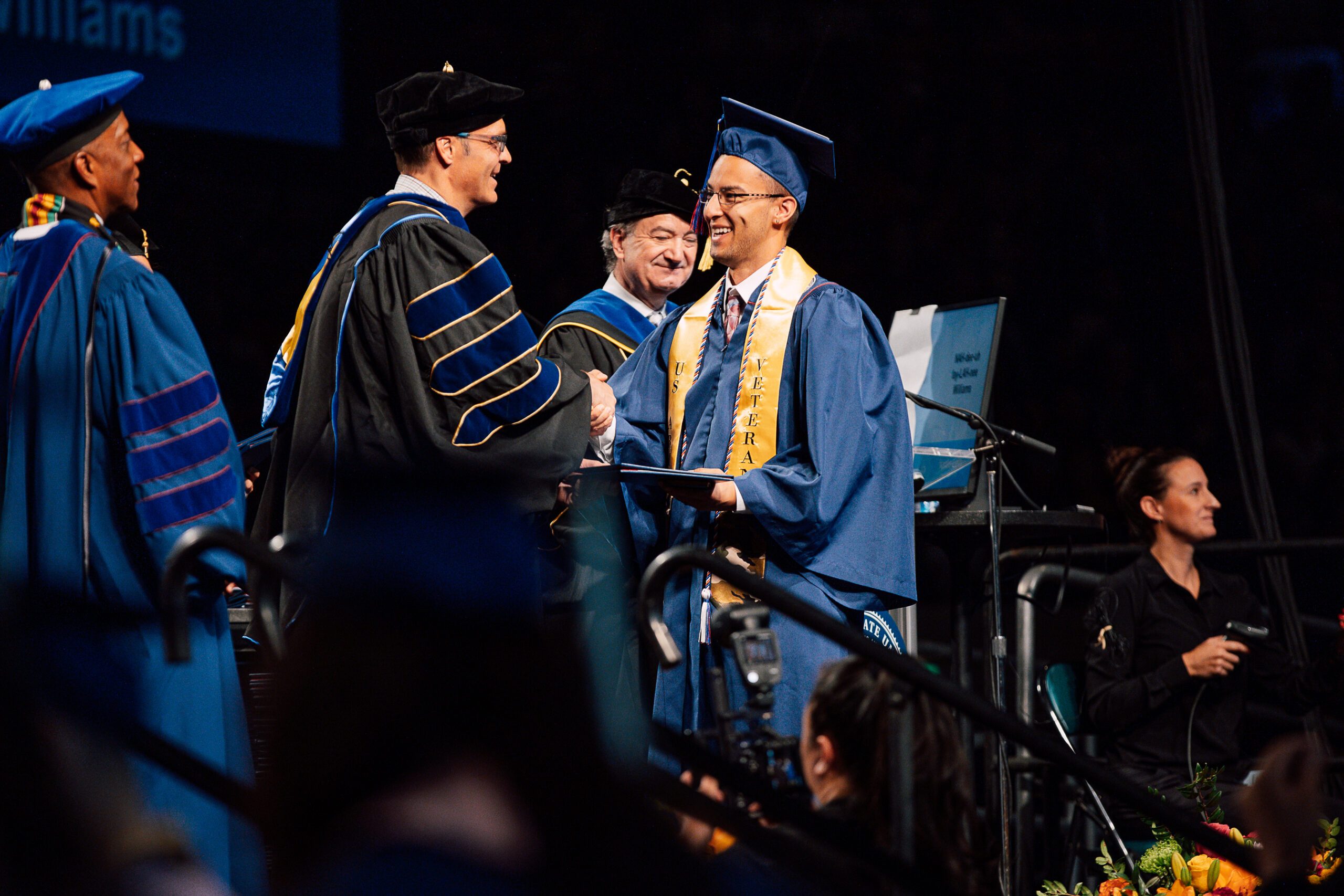Political Science Student receiving his diploma.