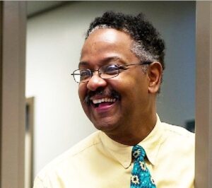 Image of Arthur Thomas standing in doorway smiling.