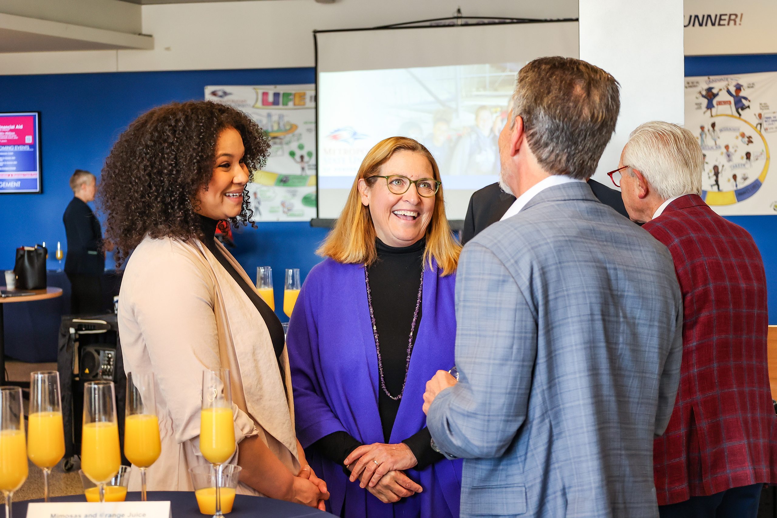 Alyssa Joseph, Dean Liz Hinde, and Ferd Belz sharing a laugh